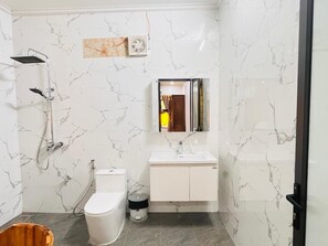 A bathroom with a shower, toilet, sink, and mirror. - Ninh Binh Riverside Retreat 6-10 Guests near Station, Tam Coc, Hang Mua & center (Hoa Lư)