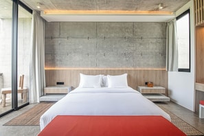 A modern hotel room with a large bed, wooden headboard, and a view through a glass door. - Modern 2BR Villa Enclosed Living, Heart of Canggu (Kerobokan)