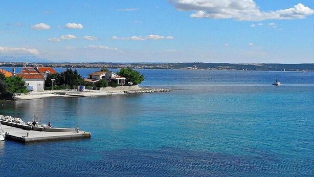 A marina with boats, a lighthouse, and buildings along the waterfront. - Amazing Place 4 Peaceful Holiday apartman PIA (Poljana)