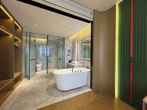 A modern bathroom with a freestanding bathtub, a glass-enclosed shower, and a large mirror. - Shanghai Kacunm Hotels (Shanghai)