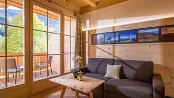 Appartamento familiare, balcone, vista giardino | Area soggiorno
