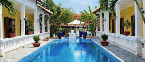 Outdoor pool, open 7:00 AM to 9:00 PM, pool umbrellas, sun loungers