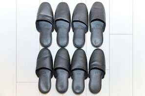 A pair of black shoes arranged in two rows of four. - Greenhills Shirokane 2 (Tokyo)