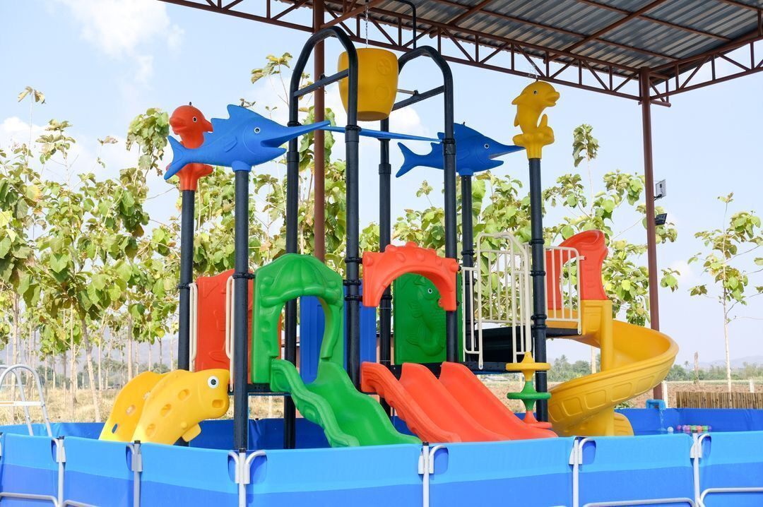 A playground with slides and climbing structures.