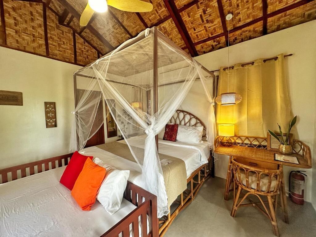 A room with a bed, a desk, and a chair.