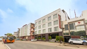 A multi-story hotel with a modern facade, a prominent entrance with steps, and a visible sign for a restaurant. - The Lohias Premium - Delhi IGI Airport (New Delhi)