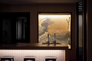 A modern kitchen with a bar area, a refrigerator, and a patterned window. - Blossom House Shibuya (Shibuyakumaruyamacho)