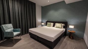 Deluxe appartement, 3 slaapkamers, gedeeltelijk uitzicht op oceaan | Een strijkplank/strijkijzer, gratis wifi