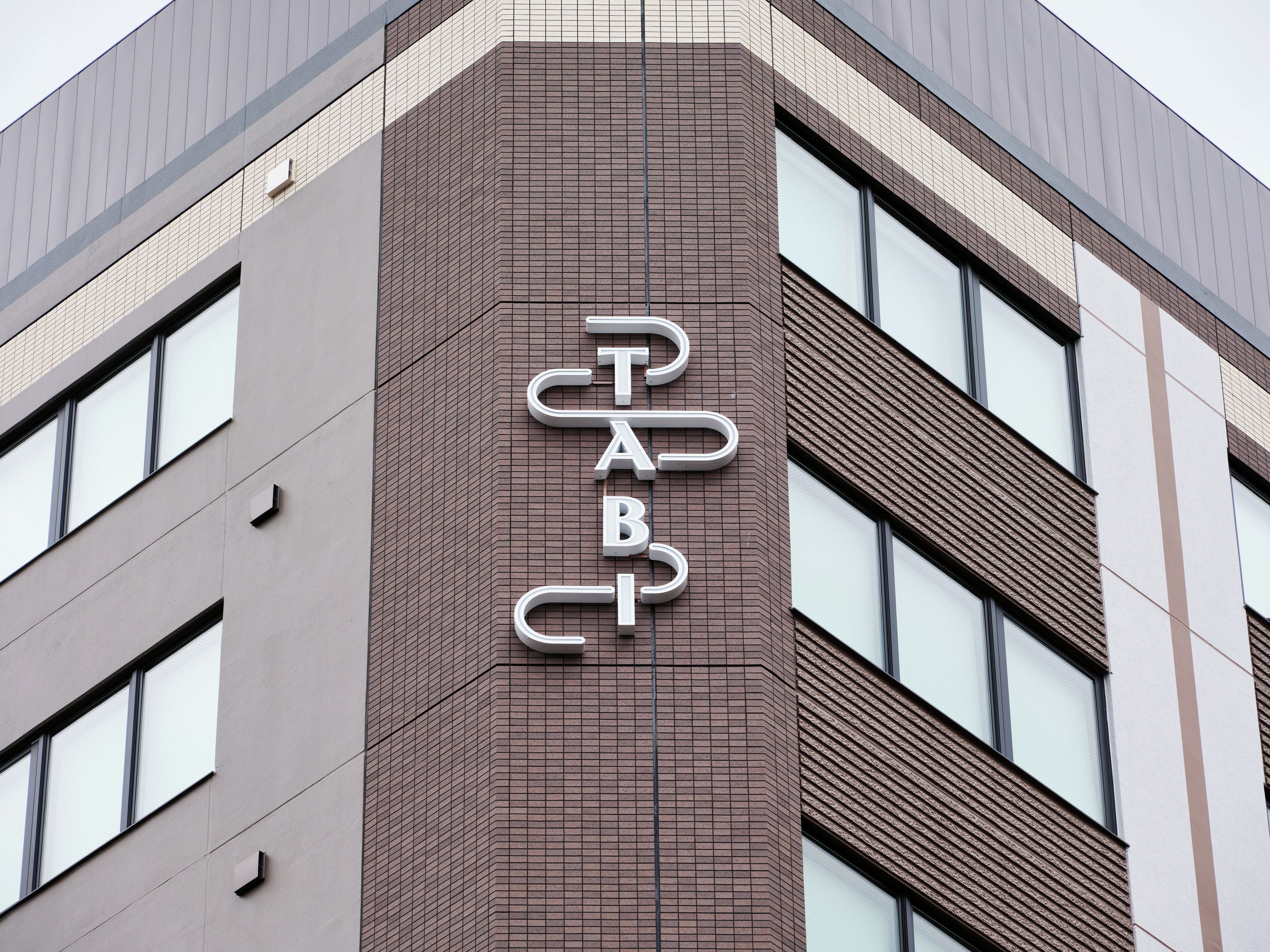 A building corner with a sign reading 'PAB'.