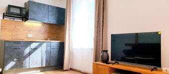 Modern vacation apartment with kitchen and bathroom between lakes, forests and fields