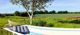 Modern vacation apartment with kitchen and bathroom between lakes, forests and fields