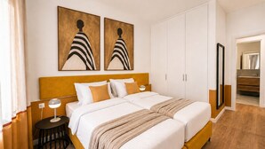 A double bed with a headboard, two bedside tables, a nightstand, and a large mirror. - LIV - Upscale Athenian Apartment 2A (Athens)