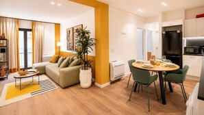 A modern apartment with a living room, dining area, and kitchen. - LIV - Upscale Athenian Apartment 2A (Athens)