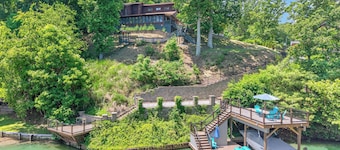 Lakefront retreat with private dock, lake views, spacious decks, pool table, and sun room!