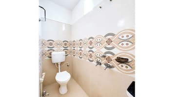 Shower, rainfall showerhead, slippers, towels