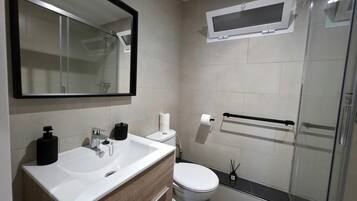 Shower, hair dryer, towels, soap
