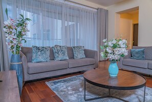 Deluxe Apartment | Living area | 42-inch flat-screen TV with digital channels - Valley Arcade by TSG (Nairobi)