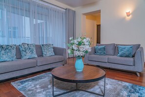 Deluxe Apartment | Living area | 42-inch flat-screen TV with digital channels - Valley Arcade by TSG (Nairobi)