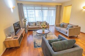 Deluxe Apartment | Living area | 42-inch flat-screen TV with digital channels - Valley Arcade by TSG (Nairobi)