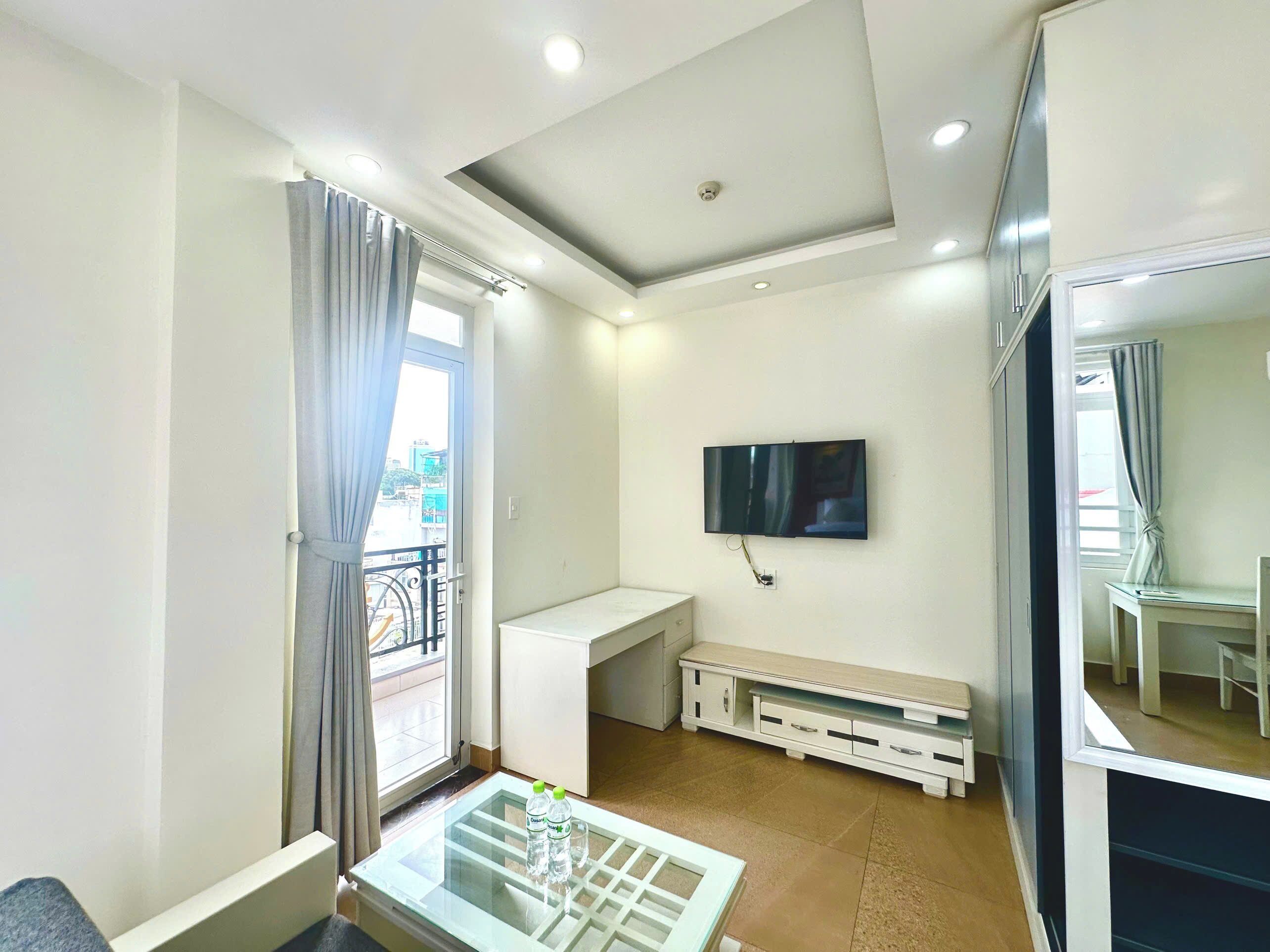 Departamento Deluxe, balcón, vista a la ciudad | Escritorio, tabla de planchar con plancha y wifi gratis 