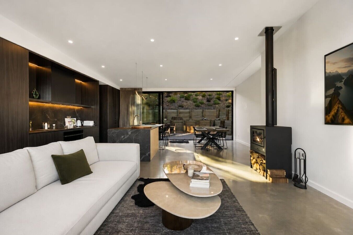 Sink into your plush sofa while the fireplace crackles, then step outside to your private dining terrace
