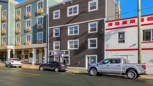 A multi-story building with a storefront on the ground floor.