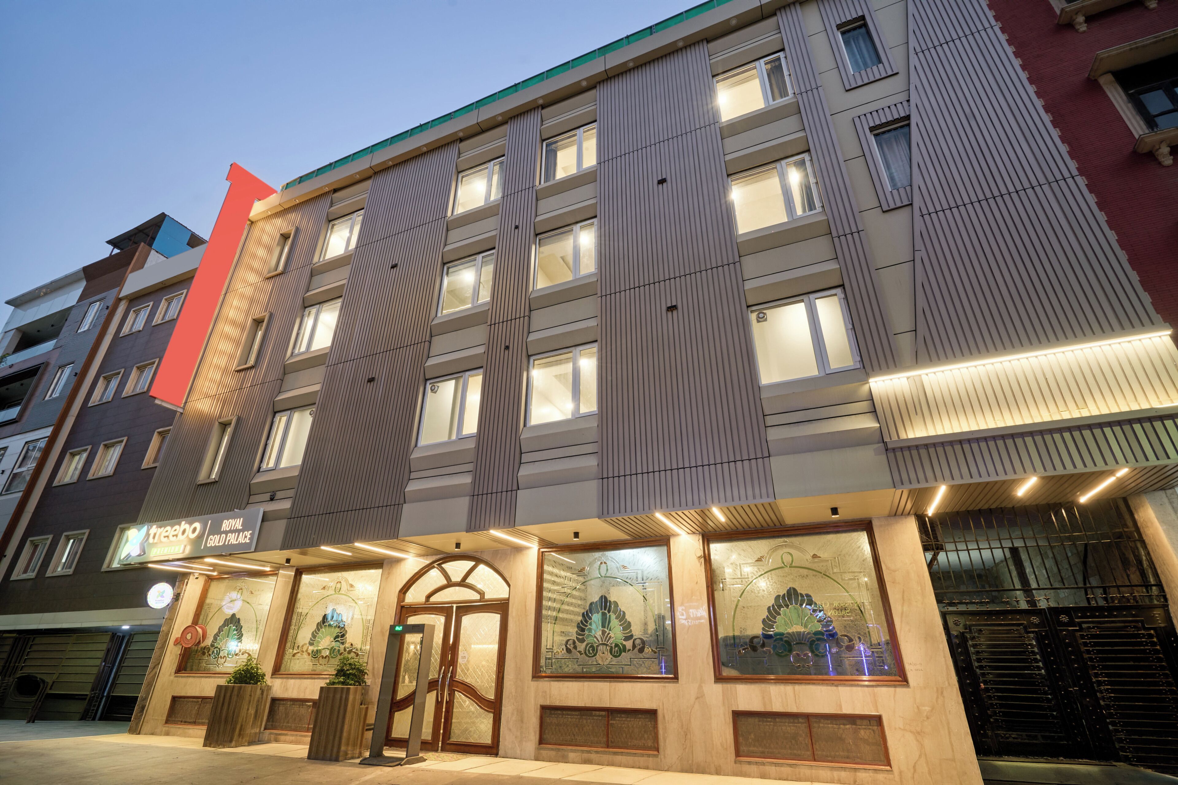 A hotel with a modern facade, large windows, and a prominent entrance.