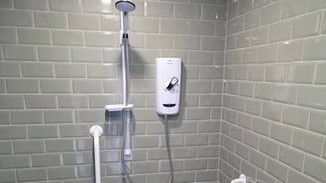 Shower, towels, soap, toilet paper