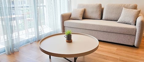 Classic Apartment, City View | Living area | Flat-screen TV