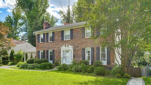 A two-story brick house with a front door, a small porch, and a well-maintained lawn. - 4 Mi to Lake Bernard Frank! Bright Unit w/ Patio (Rockville)