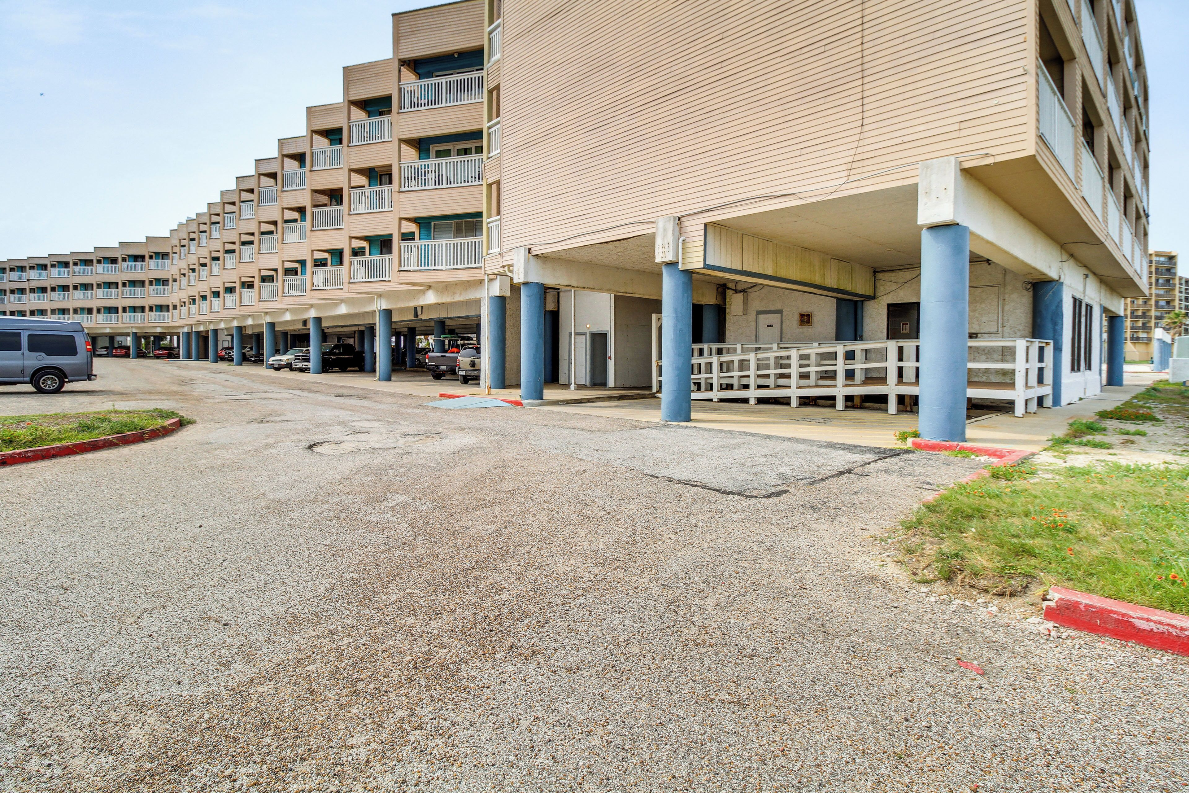 A multi-story parking structure with a series of balconies and a covered walkway.