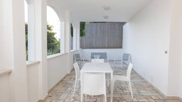 Apartment, Balcony, Sea View | Outdoor dining