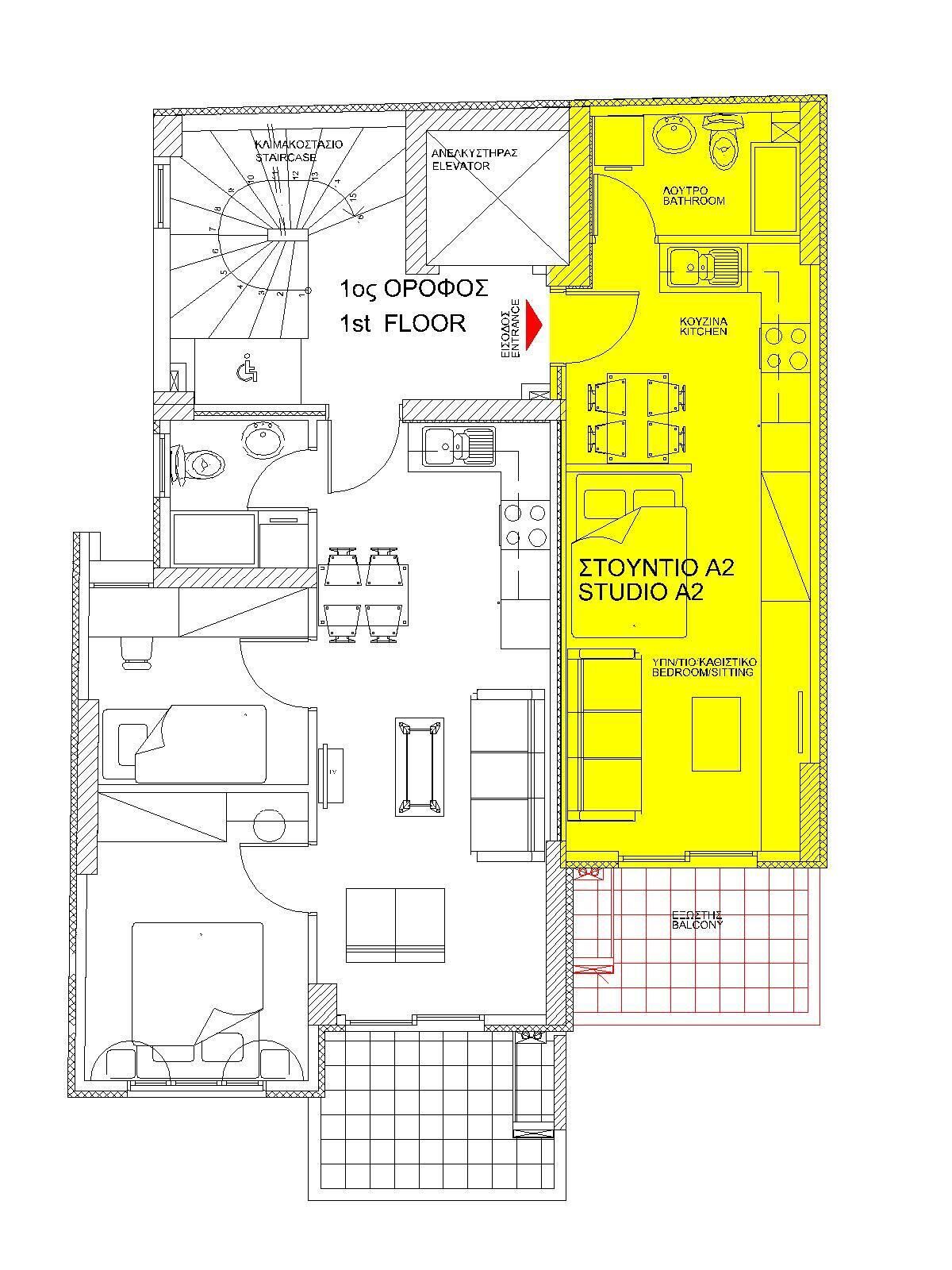 A floor plan of a hotel with a kitchenette, bathroom, and a studio apartment.