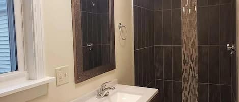 Shower, hair dryer, towels, toilet paper
