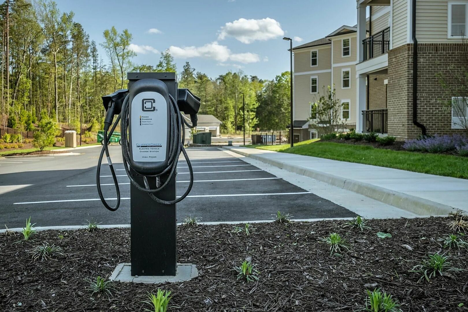 A parking area with a charging station for electric vehicles.