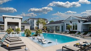 A modern resort with a swimming pool, lounge chairs, and a clear blue sky. - Landing Amazing 1BD in Northwest Side (San Antonio)