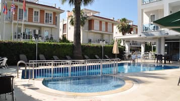 Seasonal outdoor pool, pool umbrellas, pool loungers