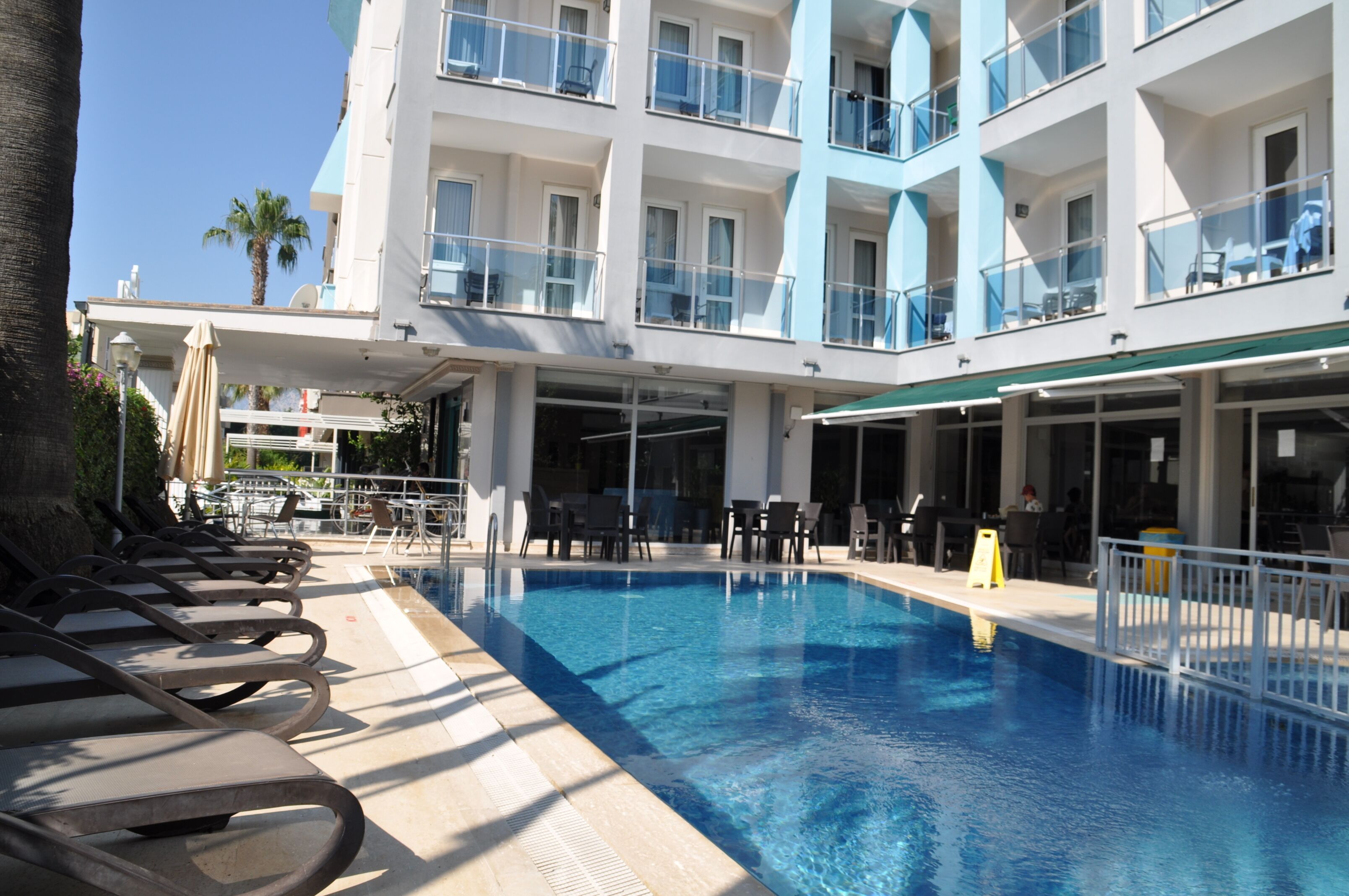 Seasonal outdoor pool, pool umbrellas, pool loungers