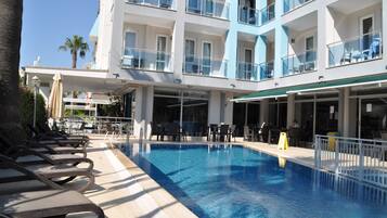 Seasonal outdoor pool, pool umbrellas, pool loungers