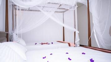 Deluxe Triple Room, Balcony, Garden View | In-room safe, soundproofing, iron/ironing board, free WiFi