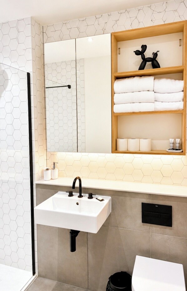 Shower, hair dryer, towels, soap