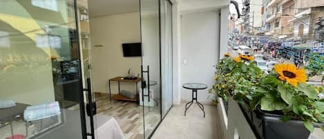 Standard Triple Room, Balcony, City View | Terrace/patio