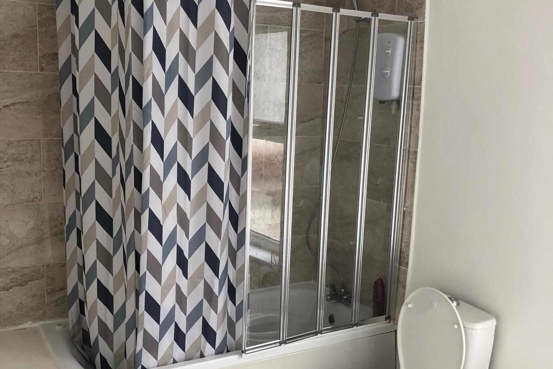 Separate bathtub and shower, deep-soaking bathtub, hair dryer, towels