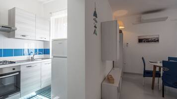 Apartamento, sacada, vista para o jardim | Cozinha privada