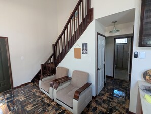 A staircase with wooden railings leading to a landing. - Quiet Poconos Chalet with Loft Lounge (ALBRIGHTSVLLE)