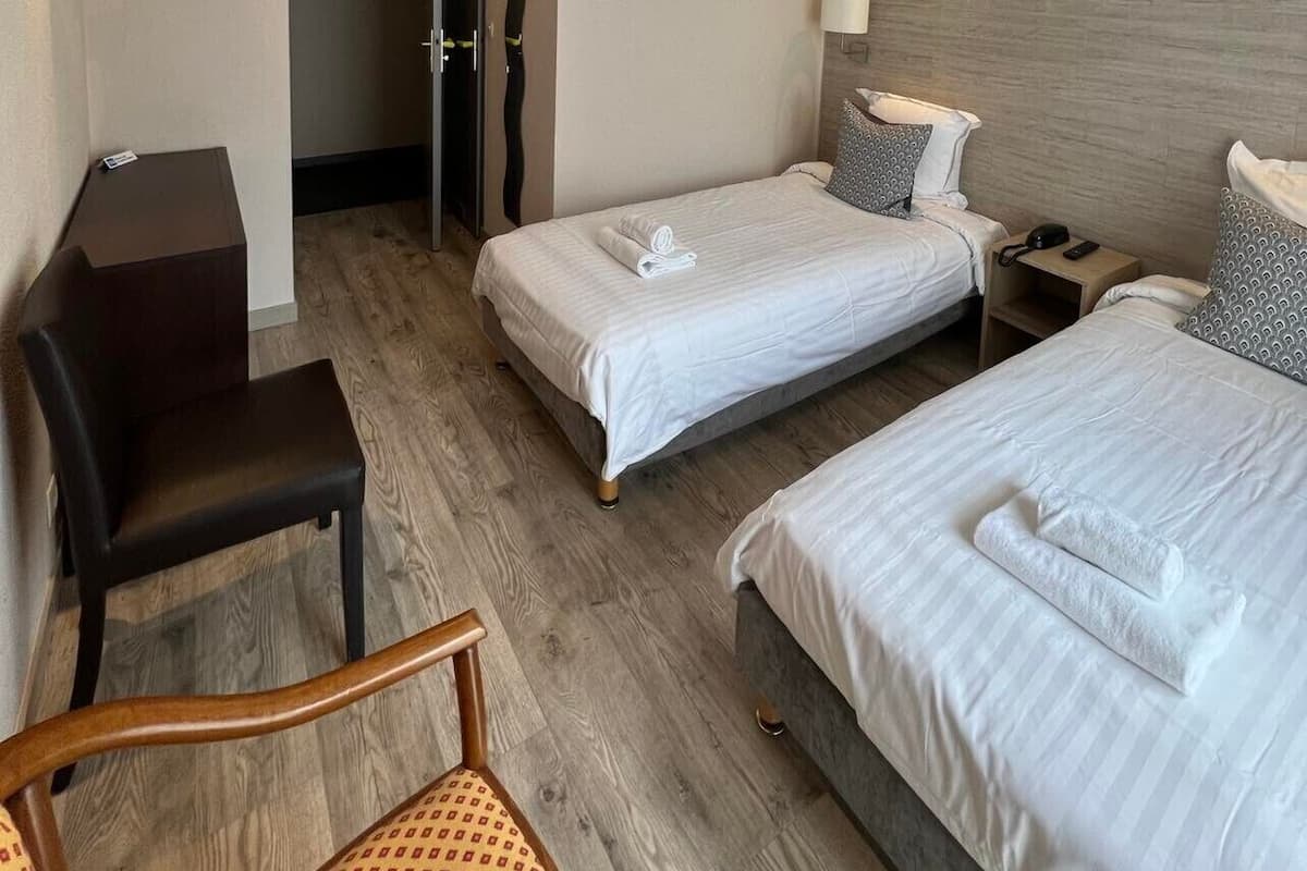 Standard Twin Room, Courtyard View | In-room safe, desk, laptop workspace, free WiFi