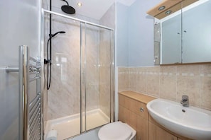 Shower, hair dryer, towels, shampoo