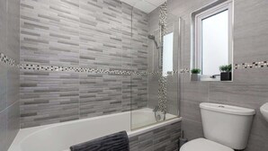 Shower, hair dryer, towels, shampoo