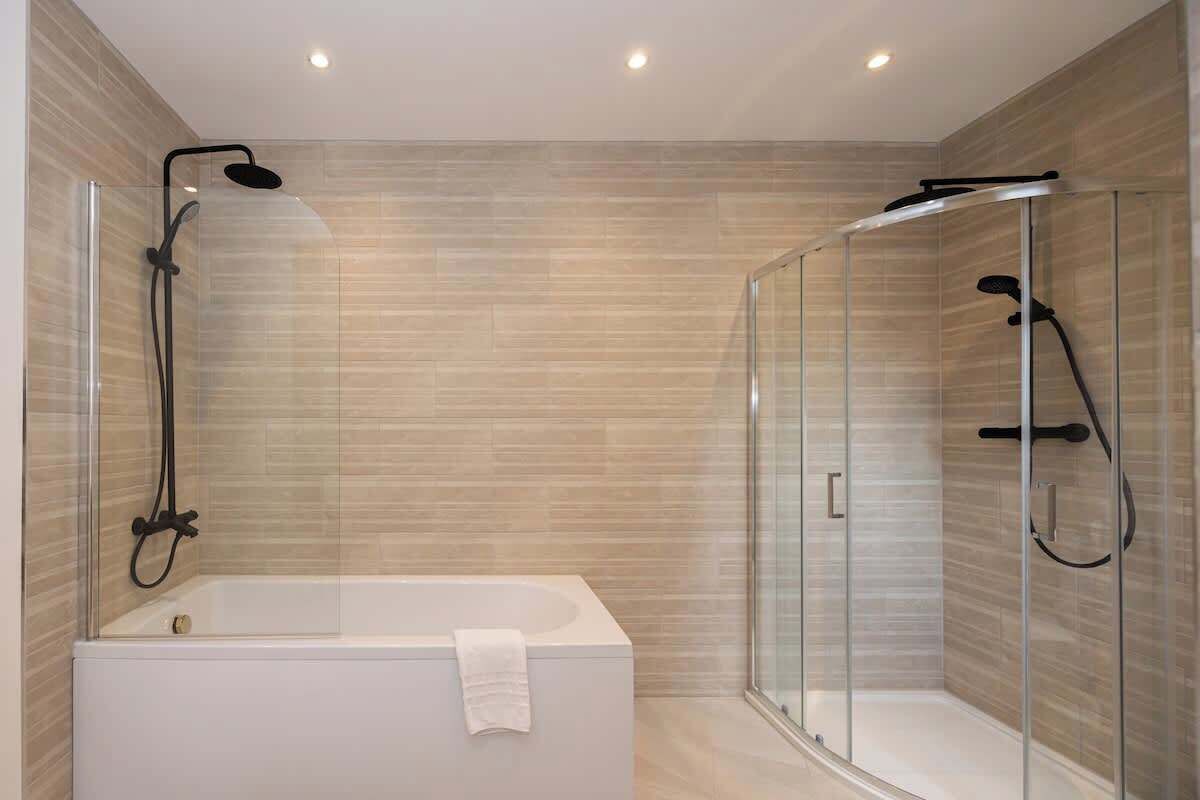 Shower, hair dryer, towels, shampoo