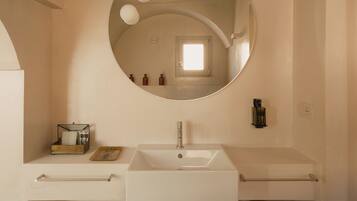 Shower, hair dryer, slippers, towels